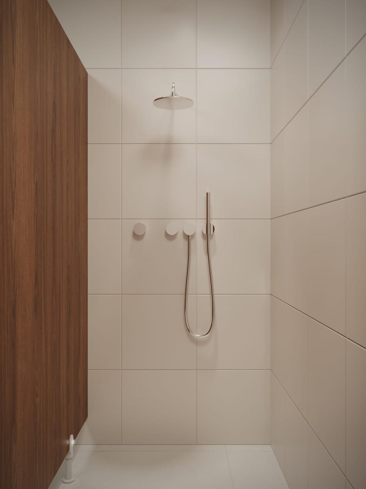 A walnut-panelled rainfall shower with brushed steel fittings